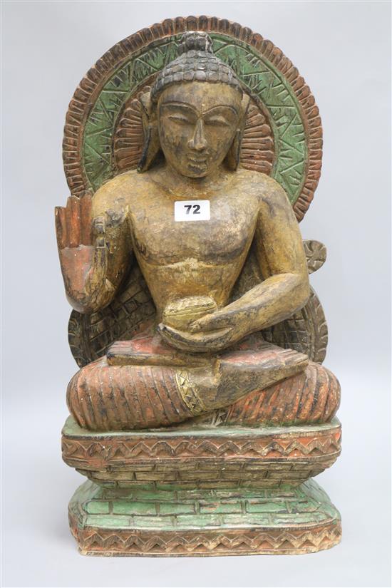 A wooden carved Buddha